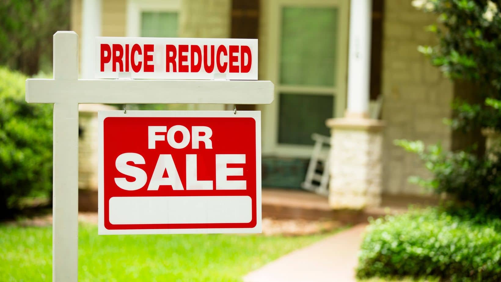 price reduced house for sale sign