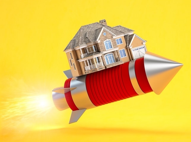 A gold house being launched on a rocket